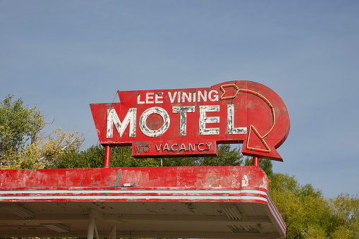 Abandoned motel sign with neon lighting