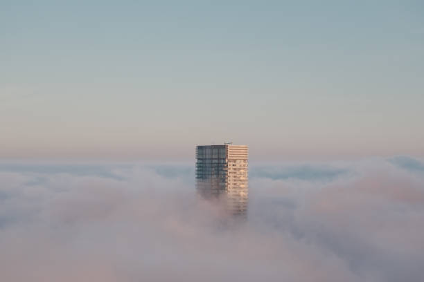 Building above clouds stock photo