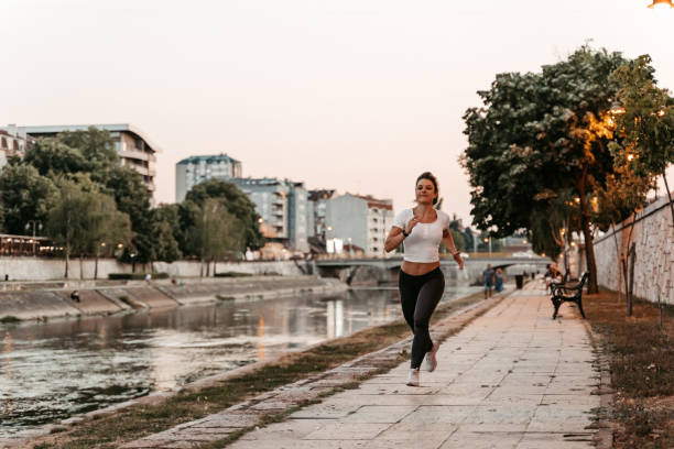 istock Young Woman Jogging On The Quayside 1439517064