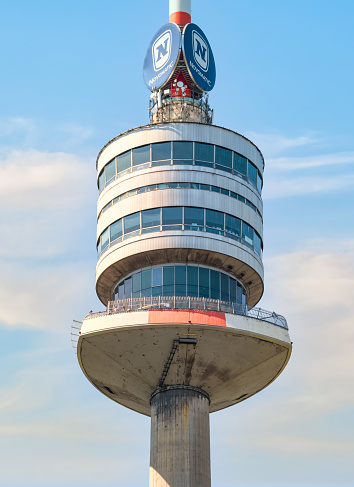 Vienna, Austria - June 2022: View with The Donauturm (Danube Tower) located in Donau Park. Iconic tower with observation terraces. Famous touristic attraction. Close up detail.