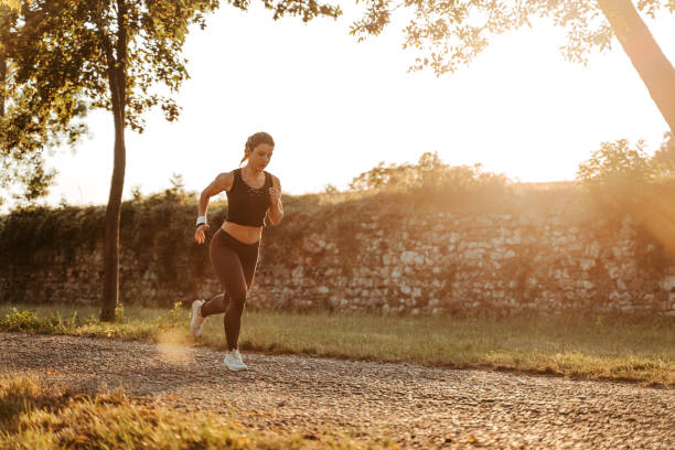 istock Young Woman Jogging In The Park 1439517685