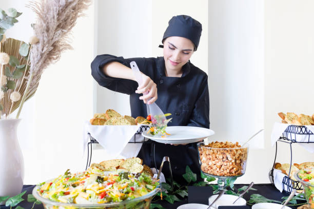 istock Latina cook serving the salad 1439525129