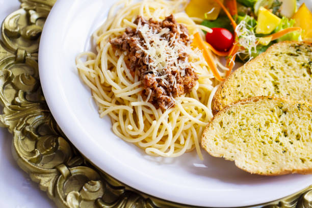 Pasta with Bolognese sauce on a plate ready to eat.