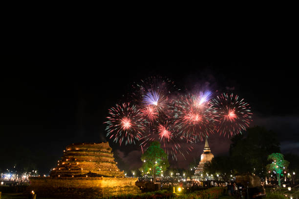 firework at event of loi krathong festival showing in sukhothai historical park, thailand. - sukhothai stok fotoğraflar ve resimler