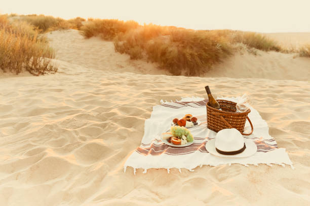 istock Wine and fruits on beach 1439526977