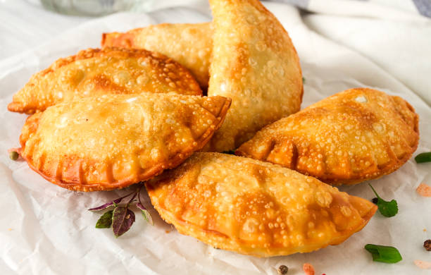 istock Fried chebureks, close-up, on a light background, no people, 1439529570