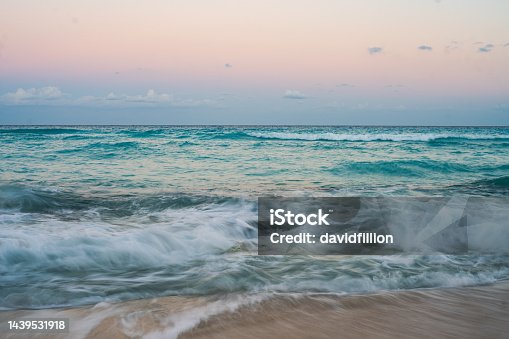 istock Slow Motion of Waves in the Ocean hitting rocks in the water 1439531918