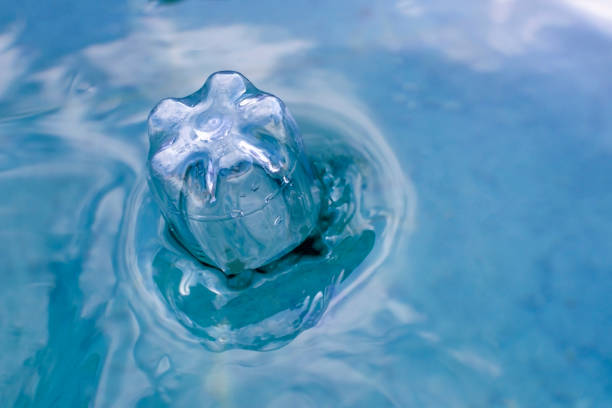 plastic bottle floats on the surface of the water. High quality photo