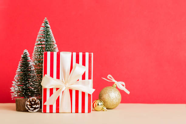 istock Christmas composition. craft Gift box, small tree, branches and craft DIY decorations on white background. New year concept. Christmas home decoration Flat lay, top view, copy space 1439537234