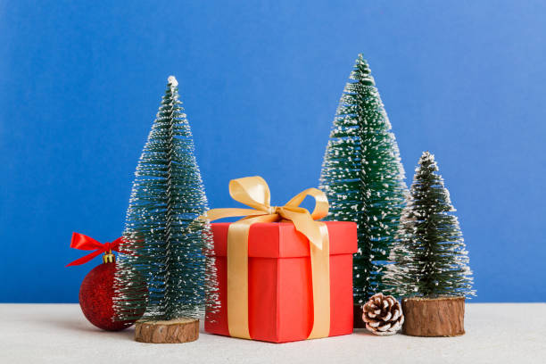 istock Christmas composition. craft Gift box, small tree, branches and craft DIY decorations on white background. New year concept. Christmas home decoration Flat lay, top view, copy space 1439537275