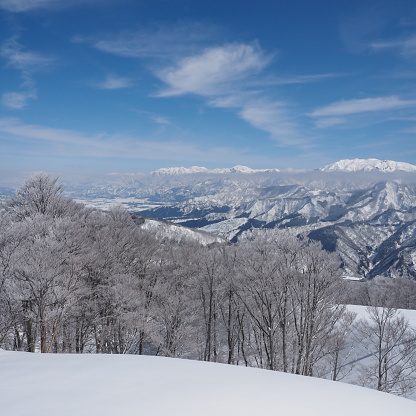 Mountain scenery in Niigata prefecture. frost covered trees. Japanese snow scene.