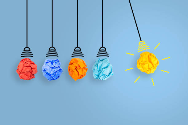 istock Creative Idea Concepts with Light Bulb Crumpled Paper on Blue Background 1439546100