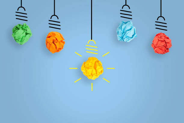 istock New Idea Concepts with Light Bulb Crumpled Paper on Blue Background 1439546171