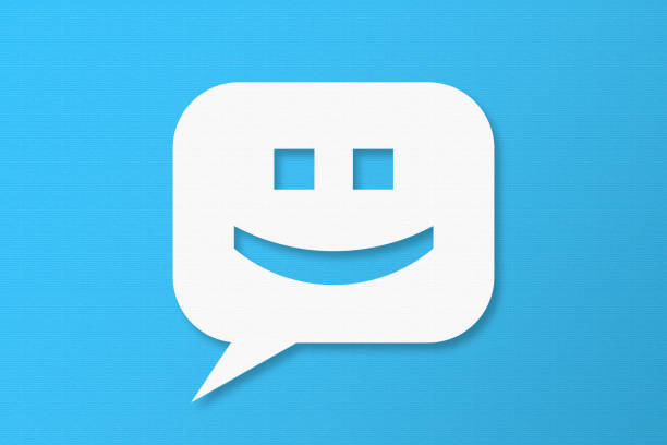 Happy and Speech Bubbles with Copy Space On Blue Cardboard Background