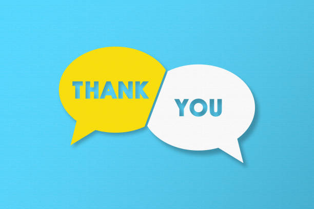 Thank You and Speech Bubbles with Copy Space On Blue Cardboard Background stock photo