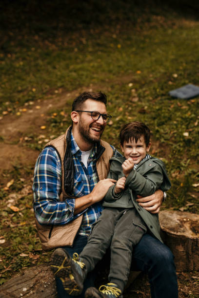 istock Playful dad and son in the forest 1439550273