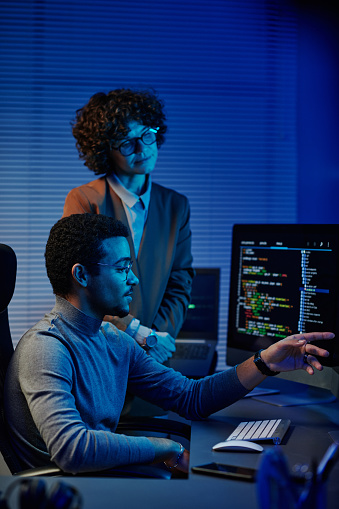 Confident It Engineer Or Software Developer Pointing At Computer Screen ...