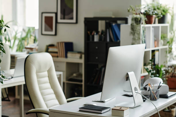 istock Computer monitor standing on workplace of office worker 1439551574
