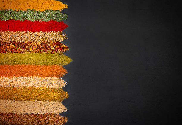 istock Different spices and seasonings on a black background 1439556287