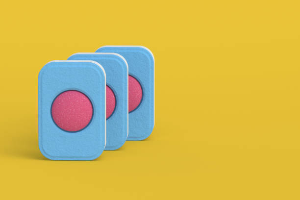 istock Row of dishwasher detergent tablets on yellow background. Copy space. 3d render 1439558344