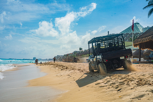 Cancun Police Patrolling the Hotel Zone Beach Strip on ATVs