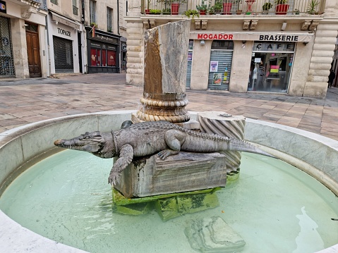 Basel, Switzerland - March 31, 2018: Famous Basilisk drinking fountain, it's symbol of the city of Basel , Switzerland