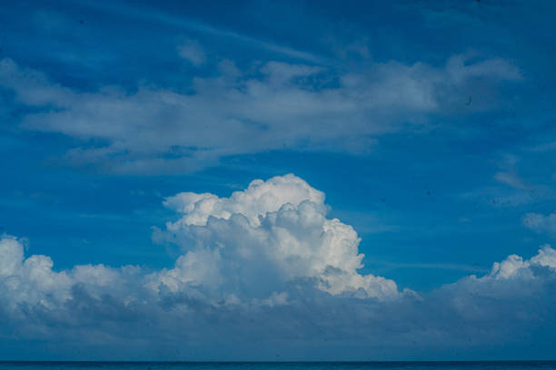 High Clouds with Blue Sky over the Ocean stock photo