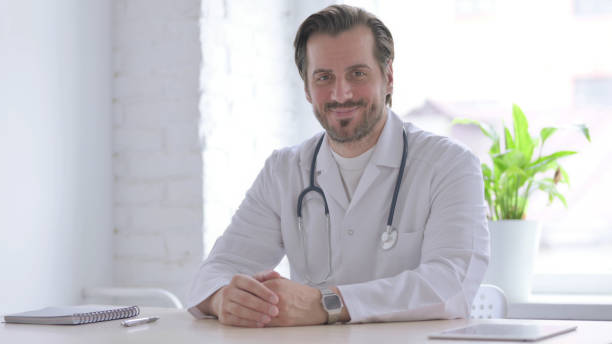 istock Young Doctor Shaking Head in Acceptance in clinic 1439559899