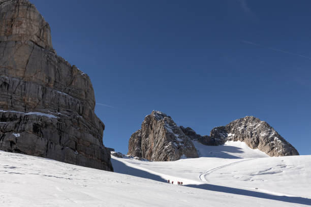 istock People and mountains on a clear day on the Dachstein Glacier, Austria, Alps 1439560652