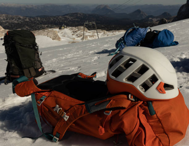 istock Several backpacks and a protective helmet lie on a snowy slope, Austria, Alps, Dachstein 1439560657