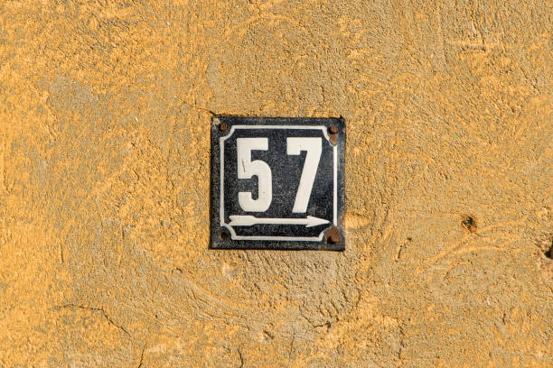 istock Weathered enameled plate number 57 1439560679