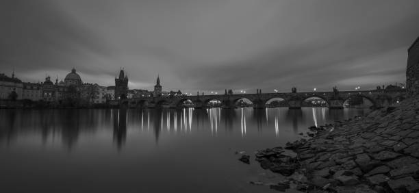 istock Dark capital Prague before cloudy sunrise over Vltava river 1439569342