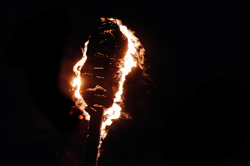 Flaming torch during parade at Lewes Bonfire celebration, November 2022
