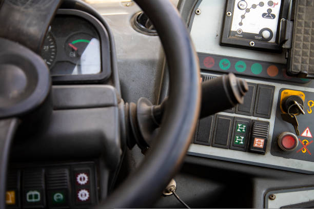 istock Control panel in the cab of a modern tractor, for agricultural or construction work. 1439570099