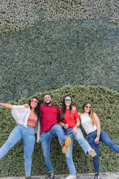 istock Hispanic Friends Having Fun In Park Together 1439576727