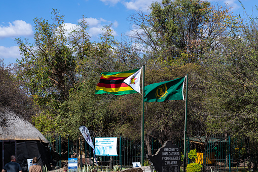 Victoria Falls Town, Zimbabwe - 1 September 2022: Victoria Falls, Mosi Oa Tunya entrance with the Zimbabwe flag in display