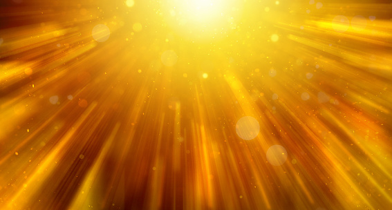 abstract golden background with a flash of light and scattered light and rays