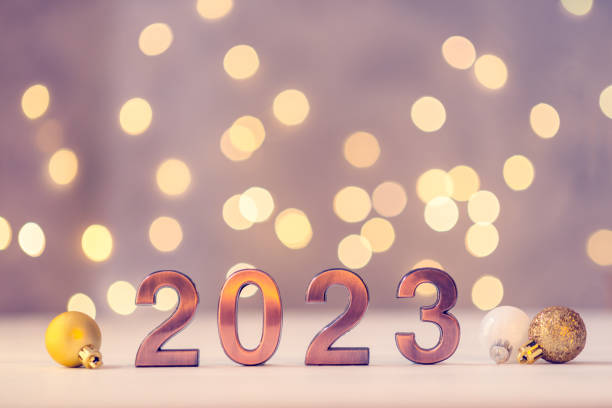 istock Metal numbers 2023 on table with bokeh lights. 1439581581