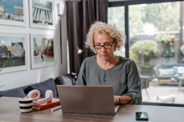istock Senior woman using laptop 1439581895