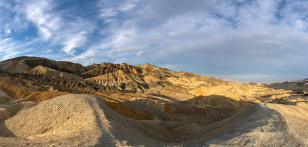 the famous twenty mule team canyon during a vibrant sunrise in the mojave desert's death valley national park california usa - awe death valley desert sandstone sunrise imagens e fotografias de stock