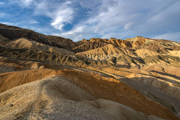 the famous twenty mule team canyon during a vibrant sunrise in the mojave desert's death valley national park california usa - awe death valley desert sandstone sunrise imagens e fotografias de stock