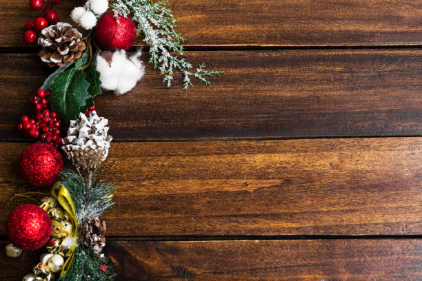 istock Christmas Holiday evergreen branches and red berries 1439584710