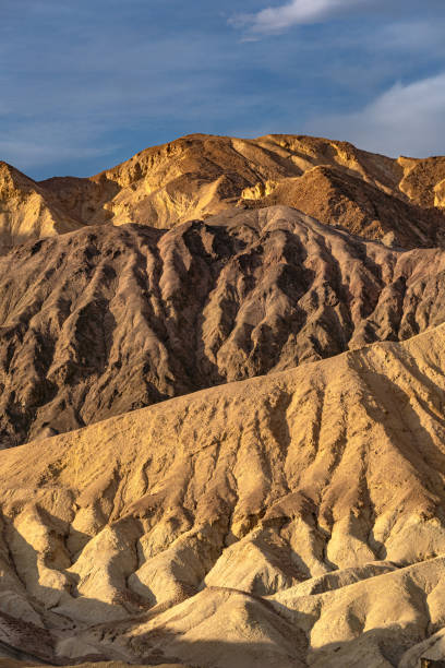 the famous twenty mule team canyon during a vibrant sunrise in the mojave desert's death valley national park california usa - awe death valley desert sandstone sunrise imagens e fotografias de stock