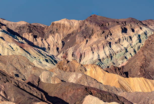 the famous twenty mule team canyon during a vibrant sunrise in the mojave desert's death valley national park california usa - awe death valley desert sandstone sunrise imagens e fotografias de stock