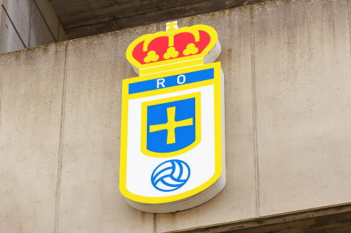 official coat of arms of the Netherlands on a brick wall