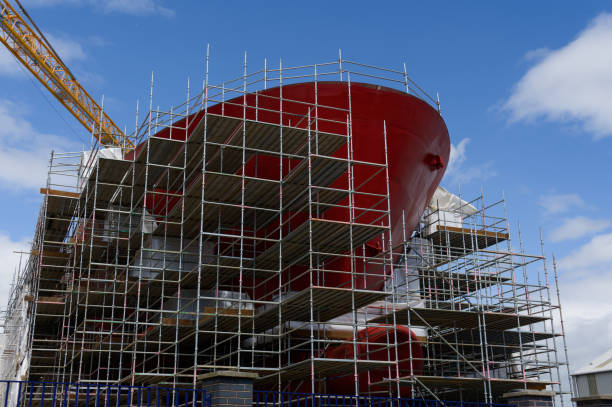 Shipbuilding and crane during ferry construction surrounded by scaffold