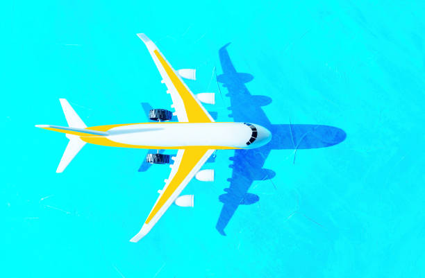 Toy plane on classic blue background, top view