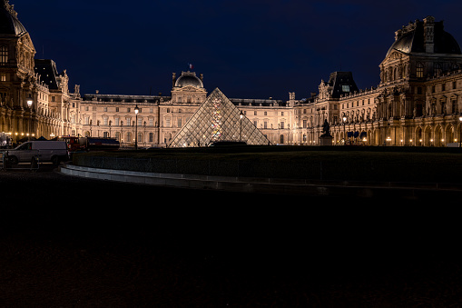 The Louvre illuminated at night from Place Du Carrousel, Paris, France