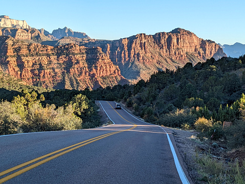 The iconic and traditional shuttle bus transporting people inside Zion National Park in Utah