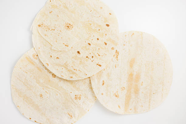 istock Mexican plain wheat tortilla wraps on white background 1439601489